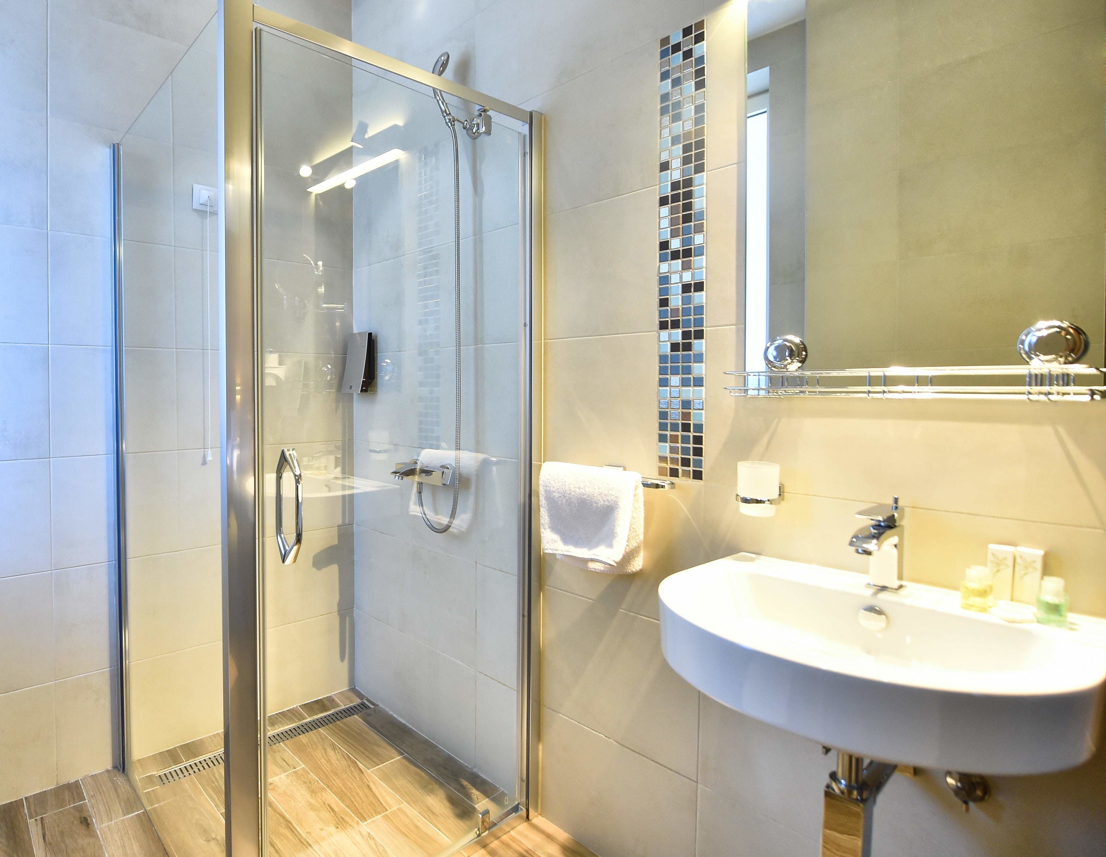 triple room with parking spot | bathroom | designer toiletries, hair dryer, bathrobes, slippers