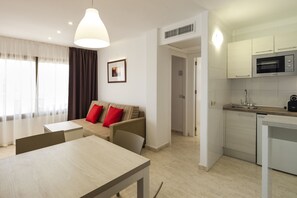 Apartment, 1 Bedroom (2 single beds + single sofa bed) | Private kitchenette | Fridge, microwave, stovetop, espresso maker