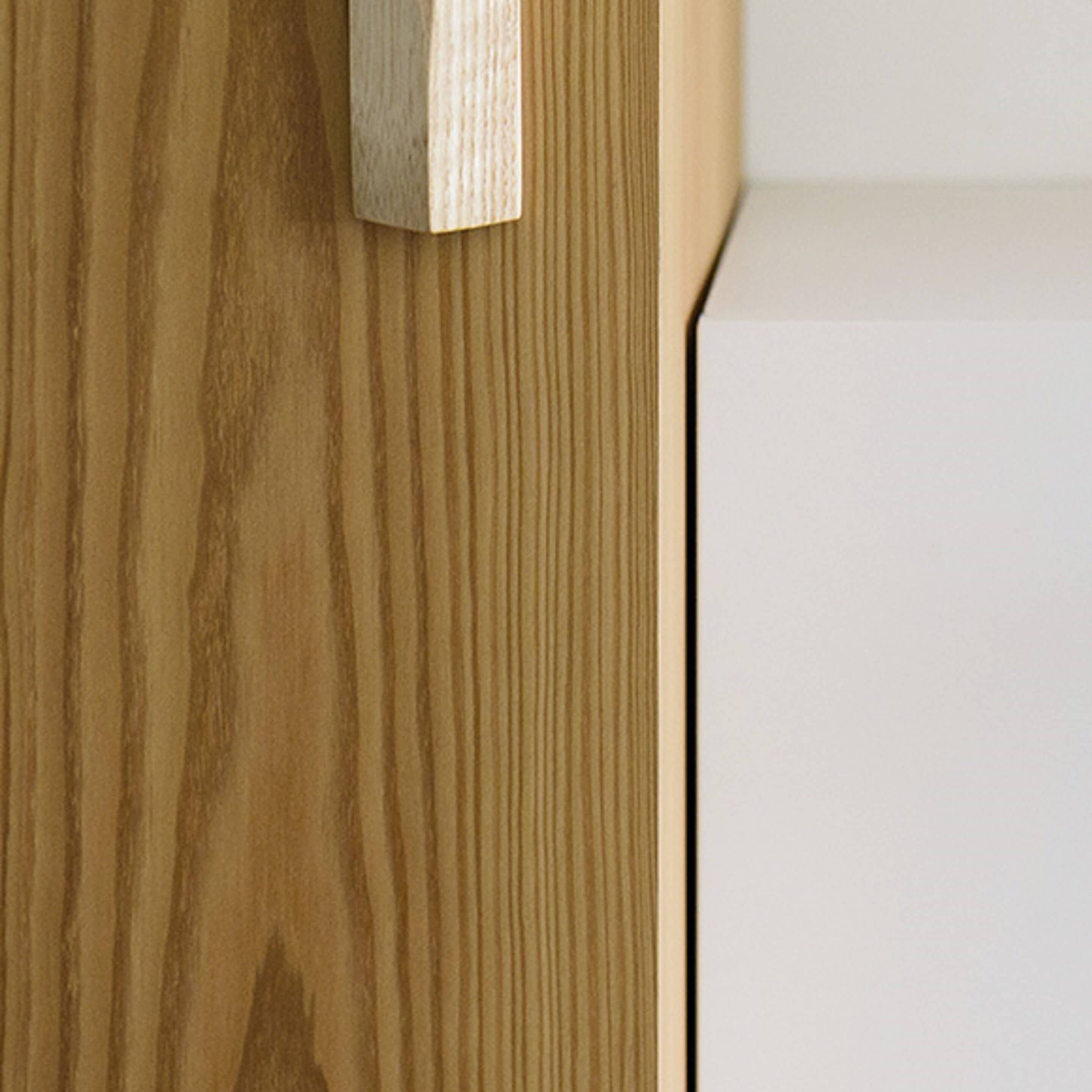 A wooden door with a simple, modern design.
