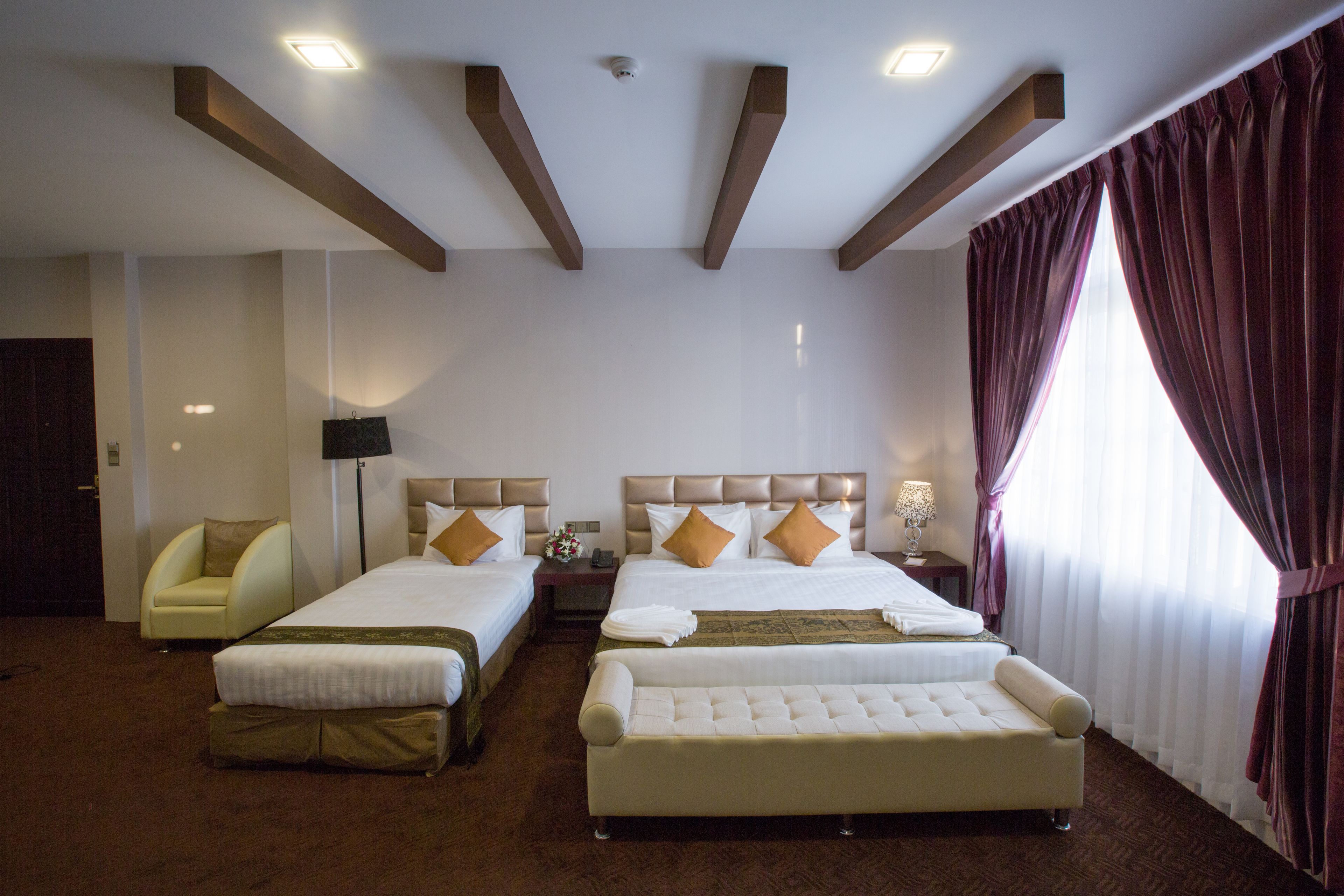 family room | minibar, in-room safe, desk, blackout curtains