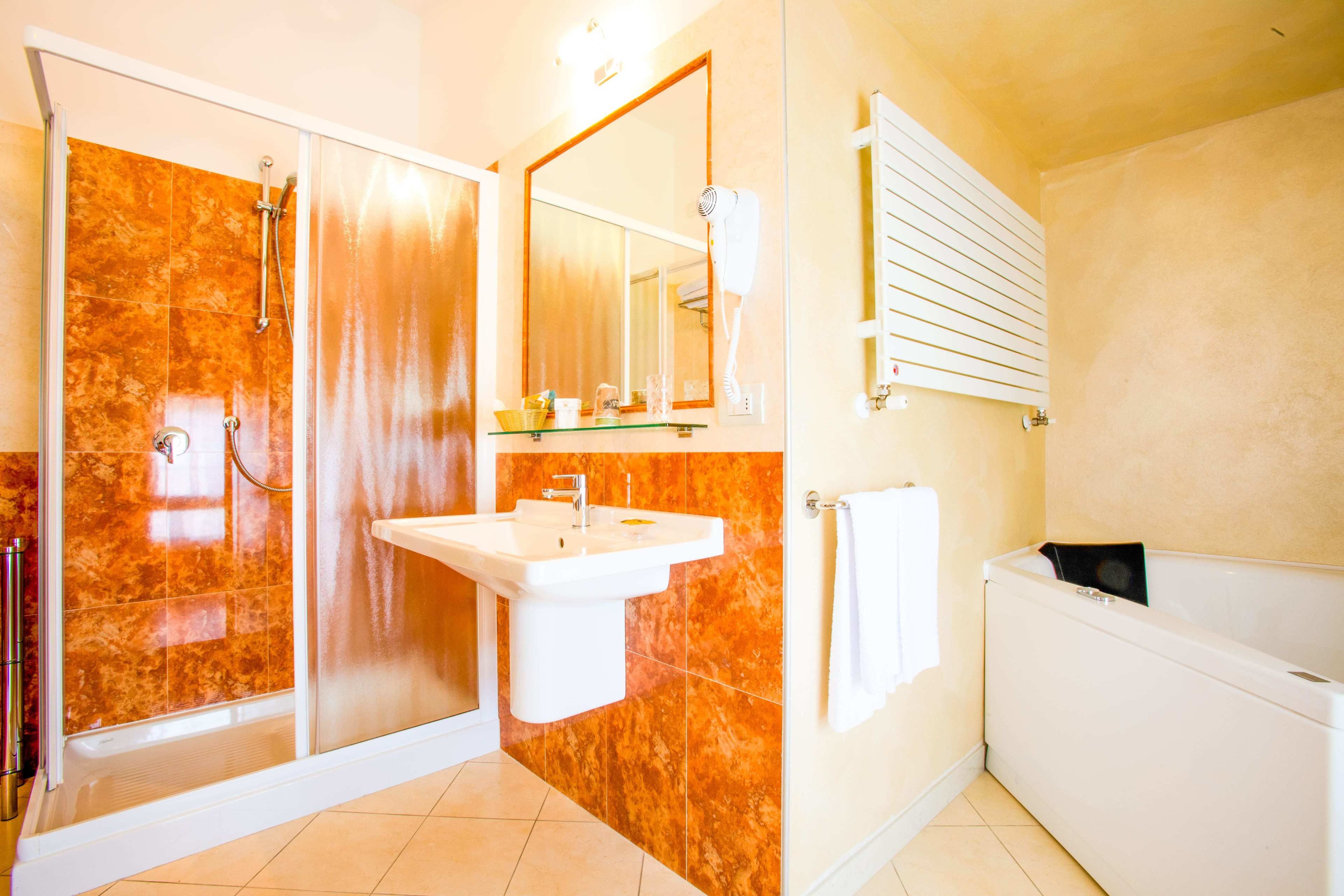 superior double room | bathroom | free toiletries, hair dryer, bidet, towels
