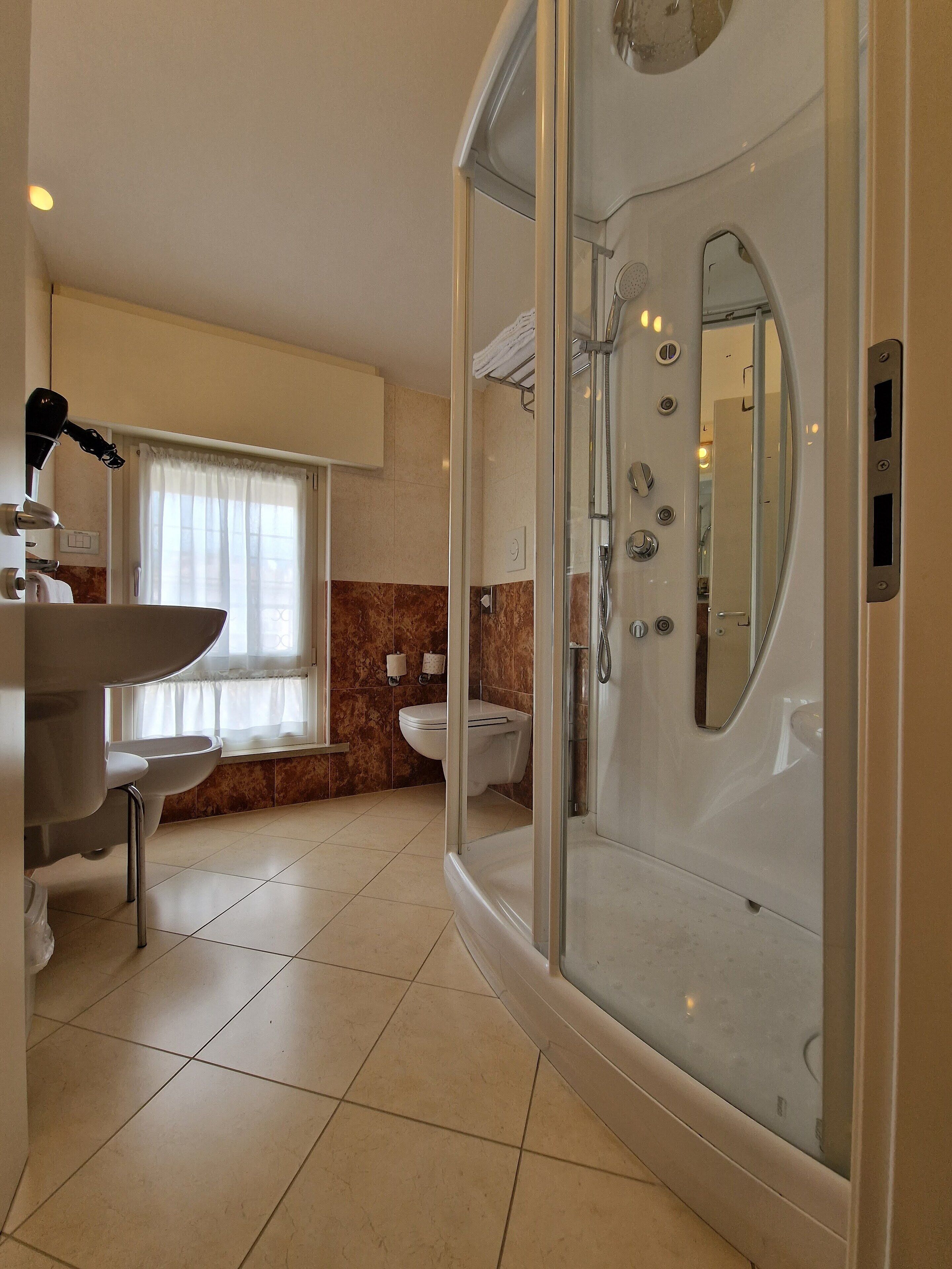 comfort room | bathroom | free toiletries, hair dryer, bidet, towels
