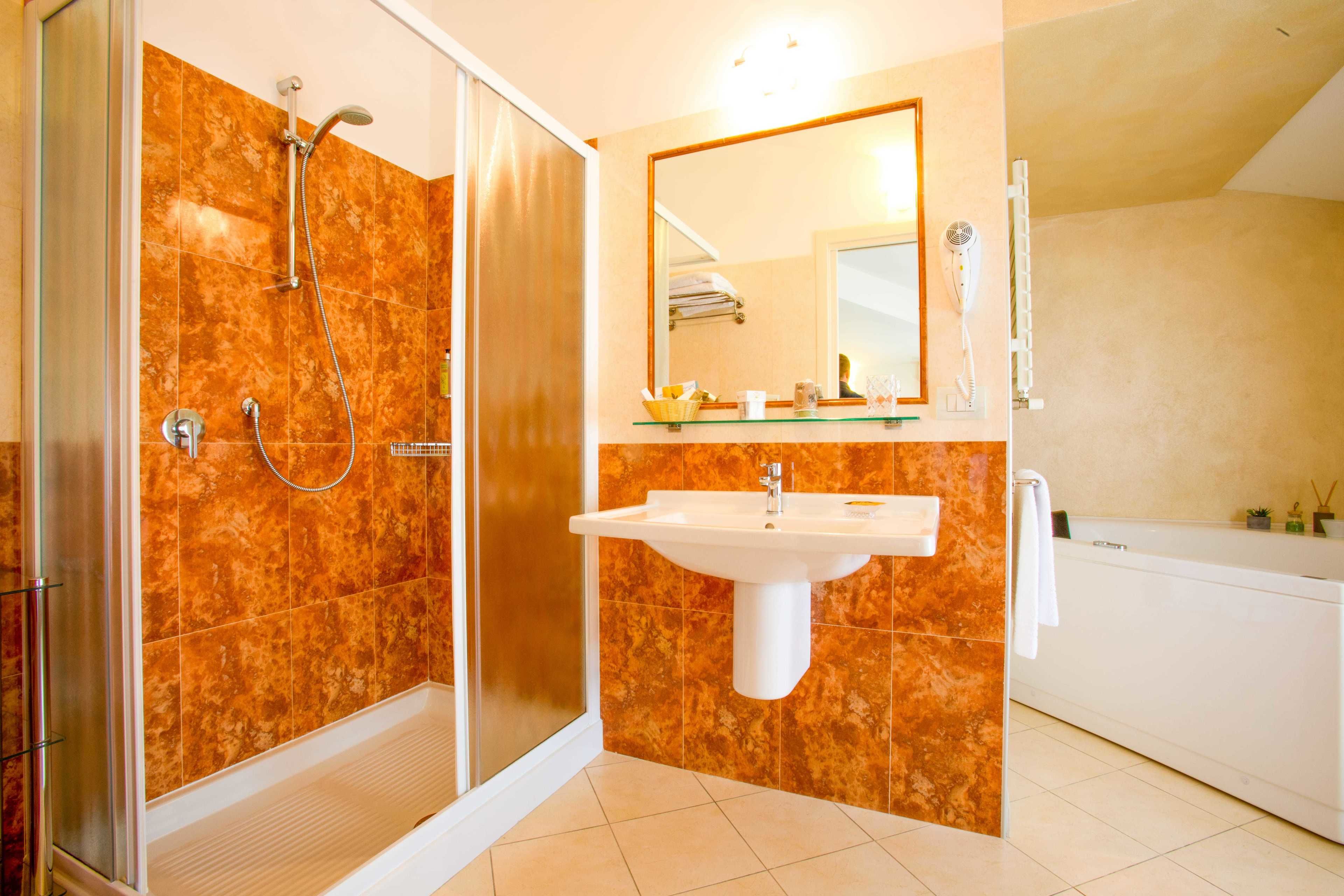 superior double room | bathroom | free toiletries, hair dryer, bidet, towels