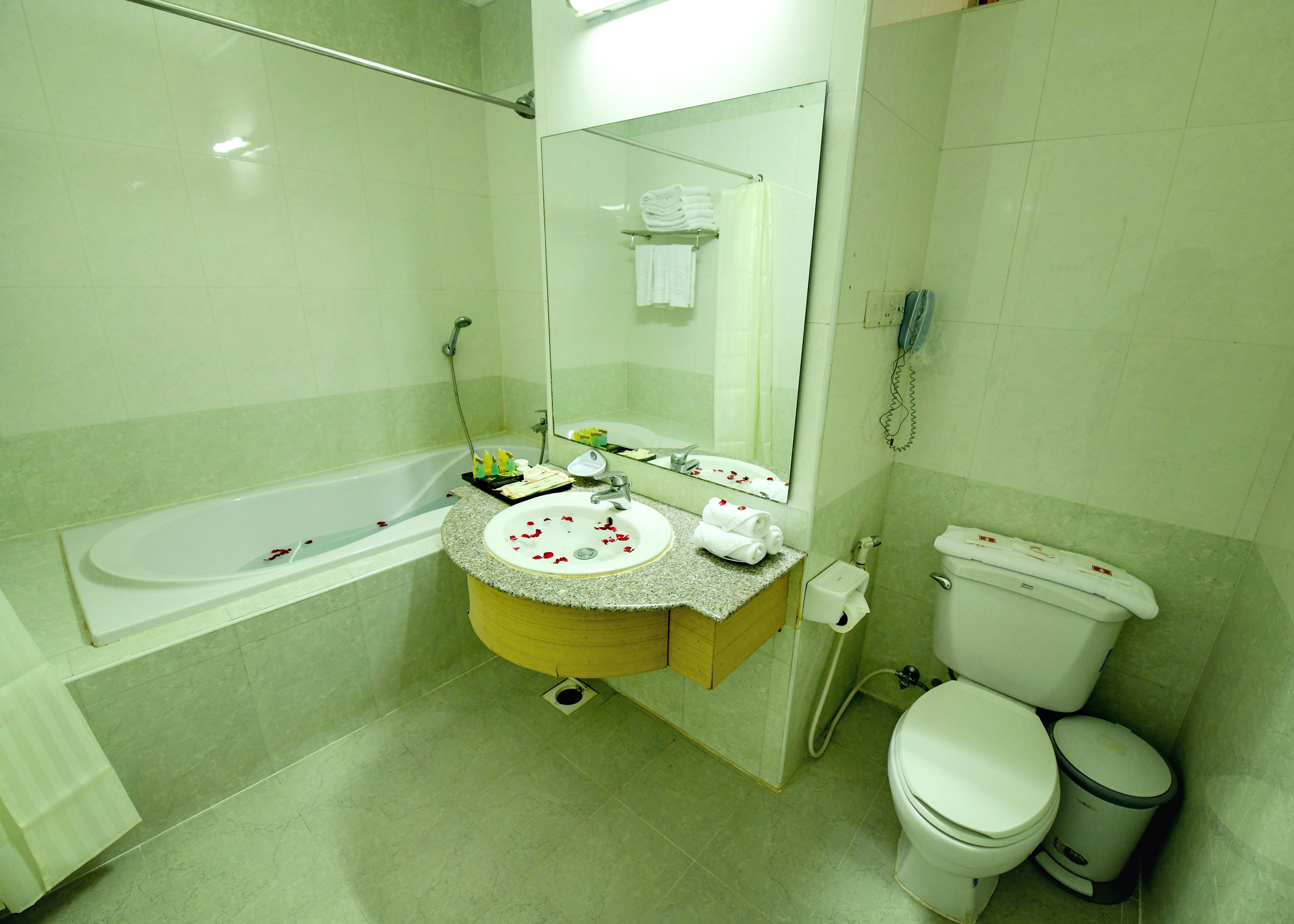 bathtub, free toiletries, hair dryer, slippers