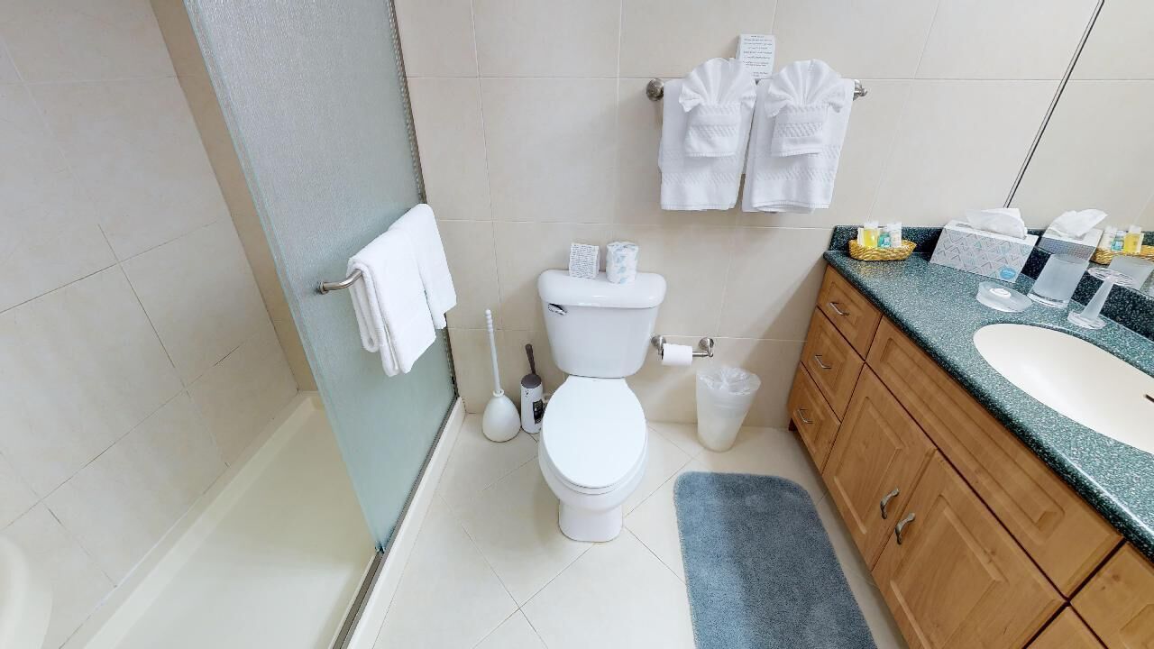 beachfront 2br, ground floor condo | bathroom | combined shower/bathtub, rainfall showerhead, free toiletries