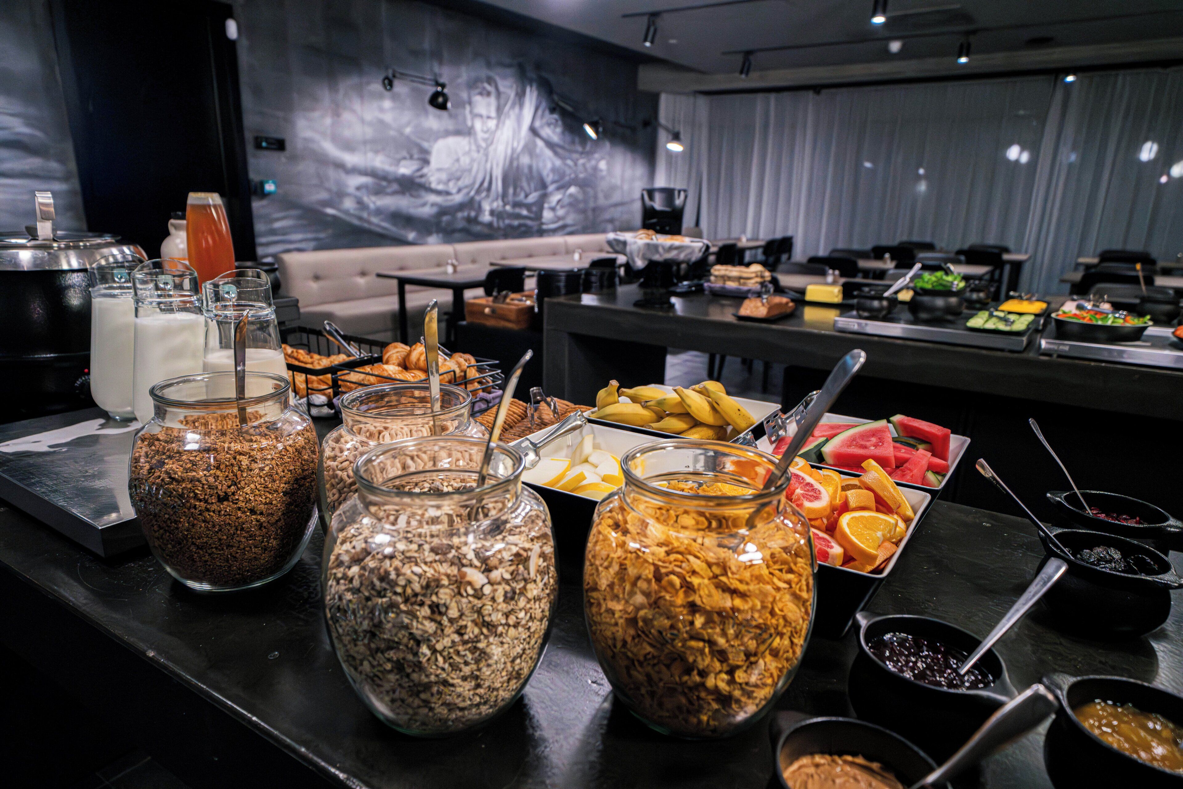 A buffet with various food items and breakfast options.