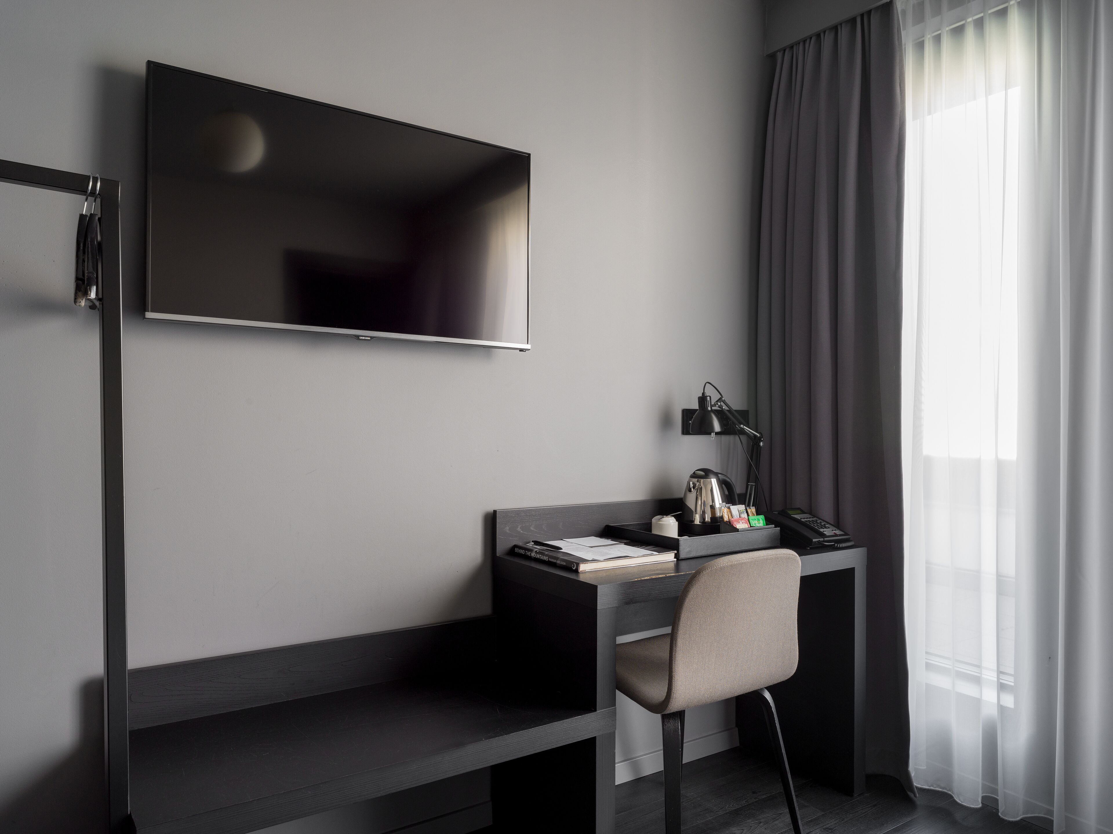 single room | premium bedding, desk, blackout curtains, iron/ironing board