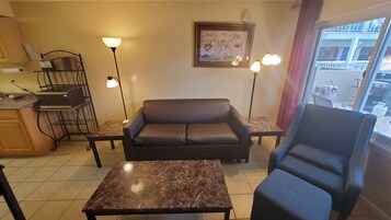 Apartment, 2 Bedrooms | Living area | 32-inch LED TV with cable channels, TV, MP3 dock