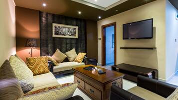 Superior Room | Living room | Flat-screen TV