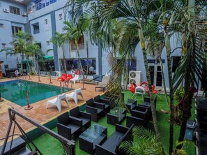 Outdoor pool, open 6:00 AM to 8:00 PM, pool umbrellas, pool loungers