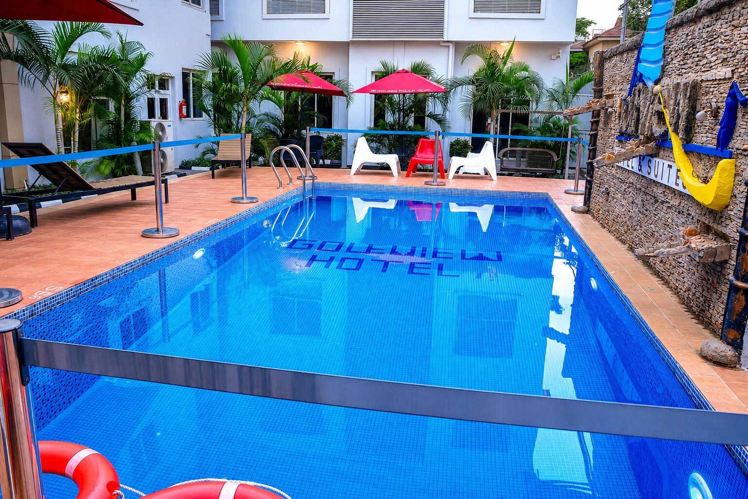Outdoor pool, open 6:00 AM to 8:00 PM, pool umbrellas, pool loungers