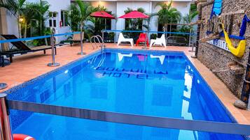Outdoor pool, open 6:00 AM to 8:00 PM, pool umbrellas, pool loungers