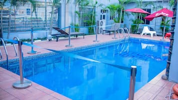 Outdoor pool, open 6:00 AM to 8:00 PM, pool umbrellas, pool loungers