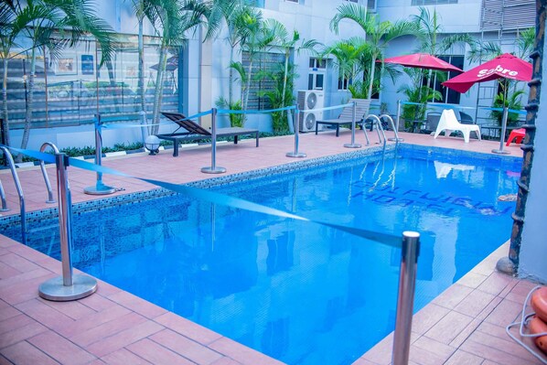 Outdoor pool, open 6:00 AM to 8:00 PM, pool umbrellas, sun loungers