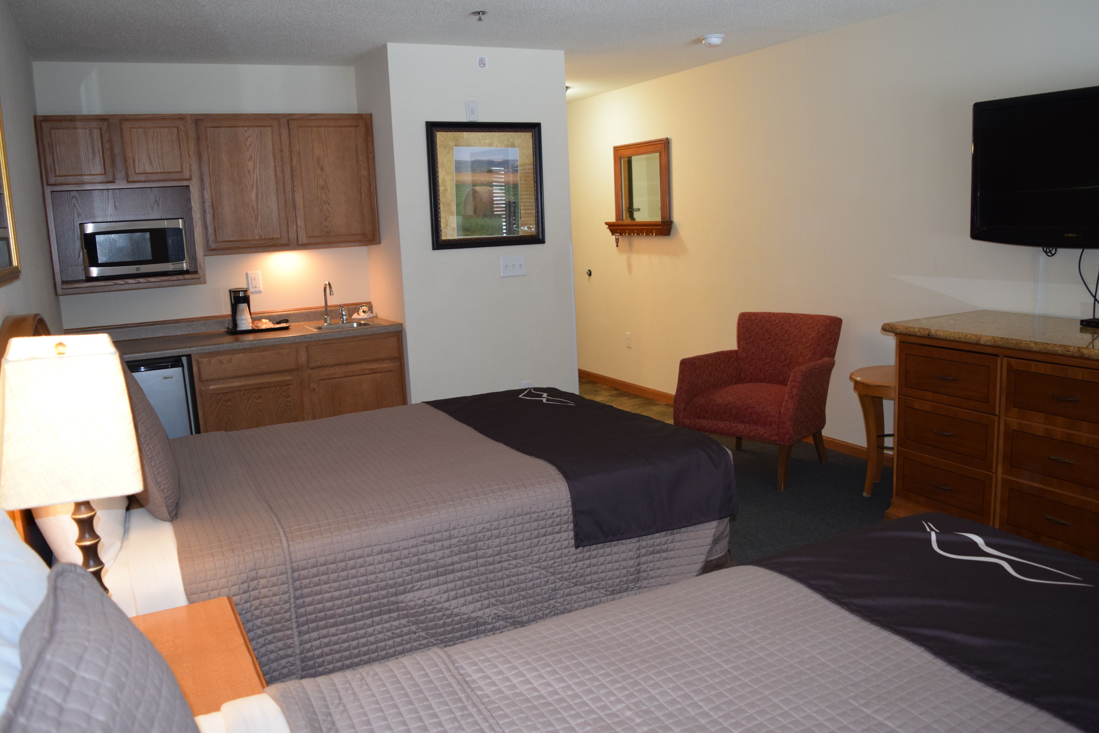 double room, kitchenette | pillow-top beds, desk, laptop workspace, blackout curtains