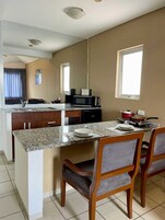 Mini-fridge, microwave, electric kettle, cookware/dishes/utensils