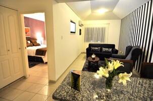 Premium Room | Living area | 32-inch flat-screen TV with cable channels