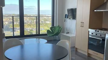 Standard Apartment, 2 Bedrooms, Balcony, City View | Living area | 32-inch LED TV with cable channels, TV