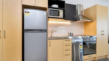 Standard Apartment, 2 Bedrooms, Balcony, City View | Private kitchen | Fridge, microwave, oven, stovetop