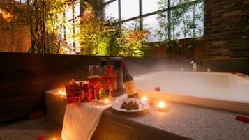 Garden Suite | Bathroom | Combined shower/tub, deep soaking tub, designer toiletries, hair dryer