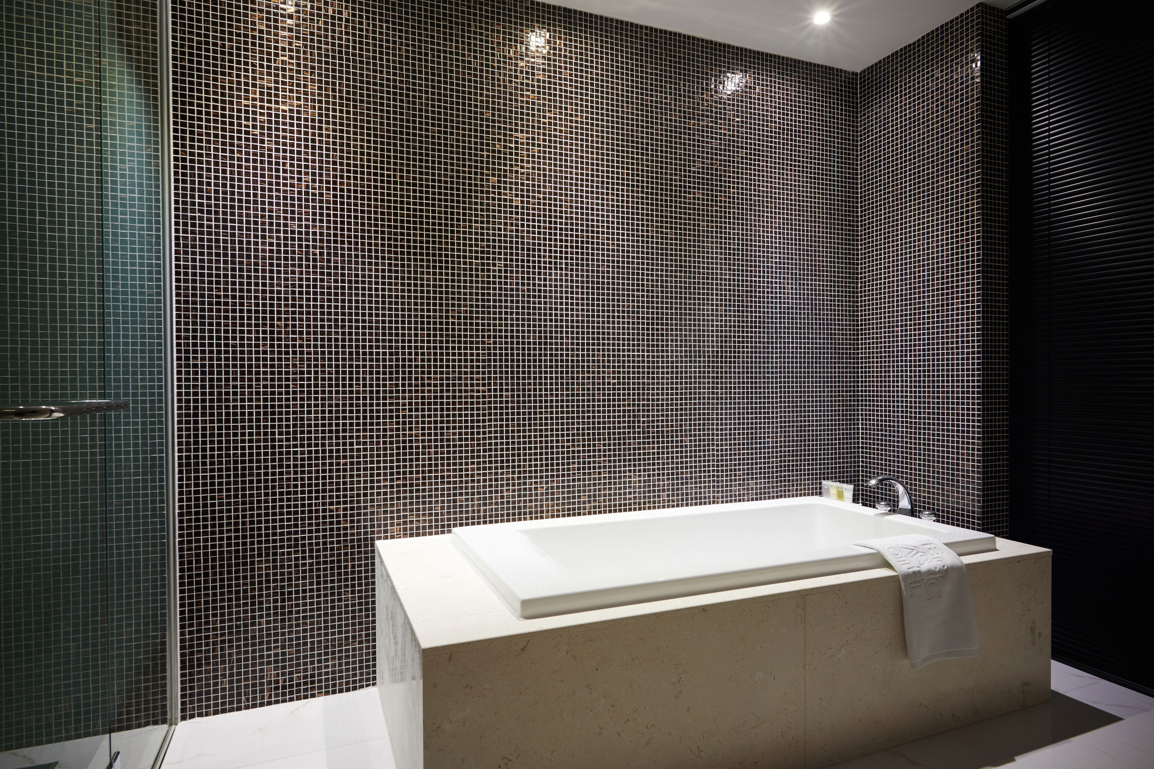 combined shower/bathtub, deep-soaking bathtub, designer toiletries