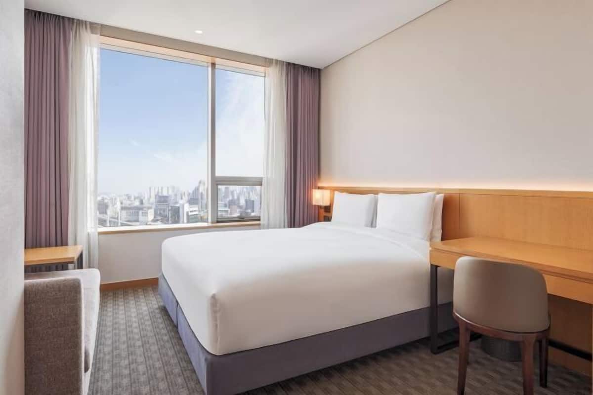 Premium bedding, down duvets, pillow-top beds, in-room safe