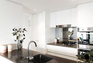 Premier Two Bedroom Apartment with Balcony | Private kitchen | Fridge, microwave, oven, stovetop - RNR Serviced Apartments North Melbourne (North Melbourne)