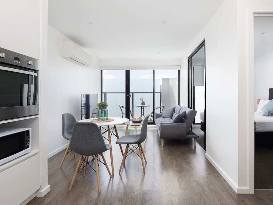 One Bedroom Apartment with Balcony | Living area | 50-inch Smart TV with satellite channels, TV