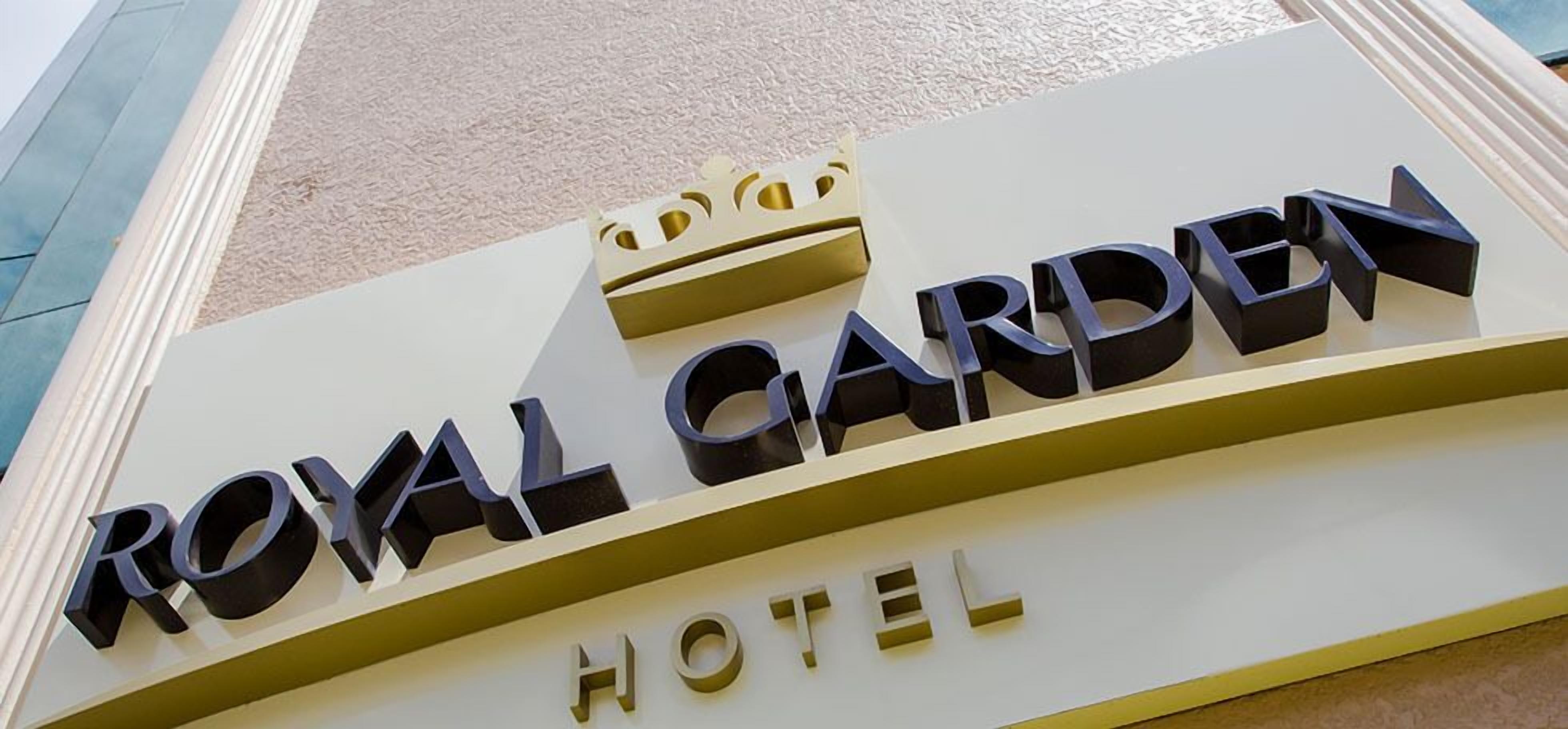 A sign for the Royal Garden Hotel.