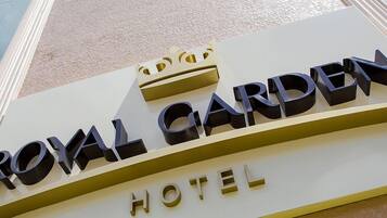 A sign for the Royal Garden Hotel.