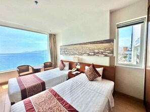 Deluxe Twin Room, Sea View | Minibar, in-room safe, desk, free WiFi