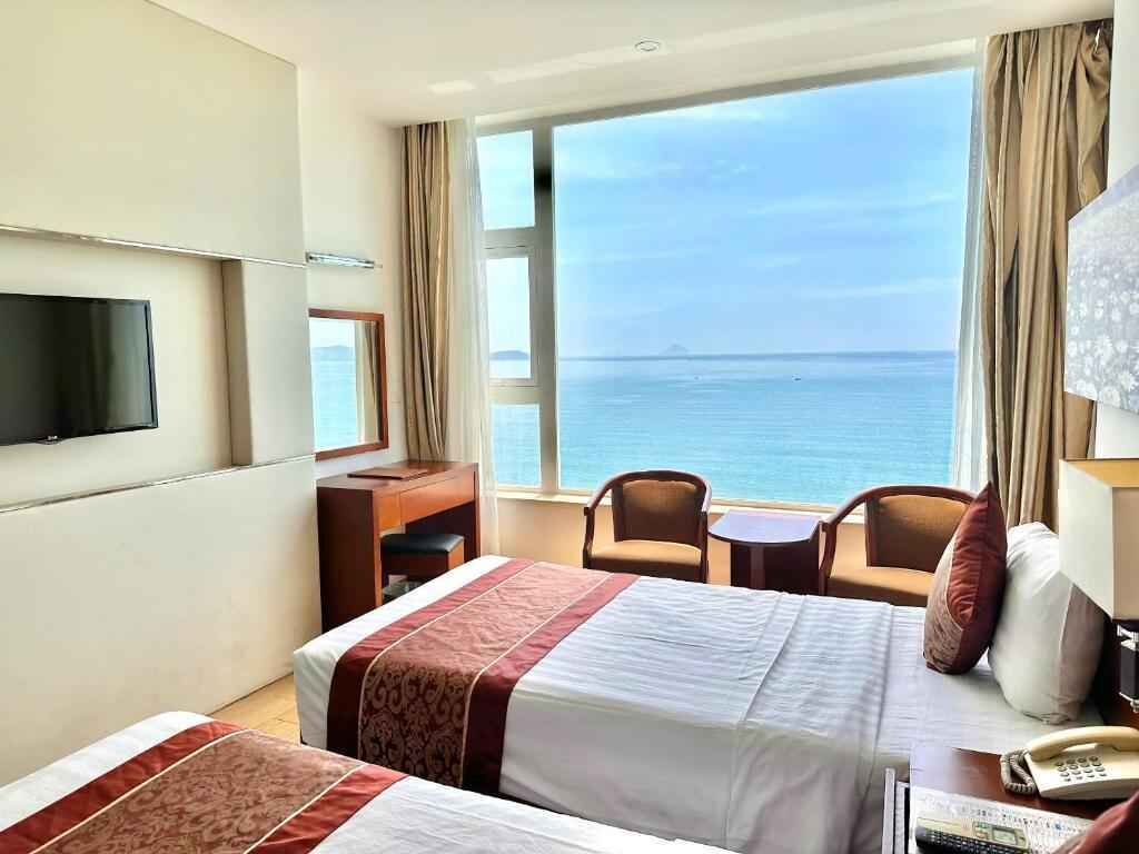 Deluxe Twin Room, Sea View | Minibar, in-room safe, desk, free WiFi