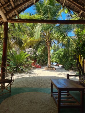 Family Room | Individually decorated, individually furnished, bed sheets - Evergreen Bungalows (Bwejuu)