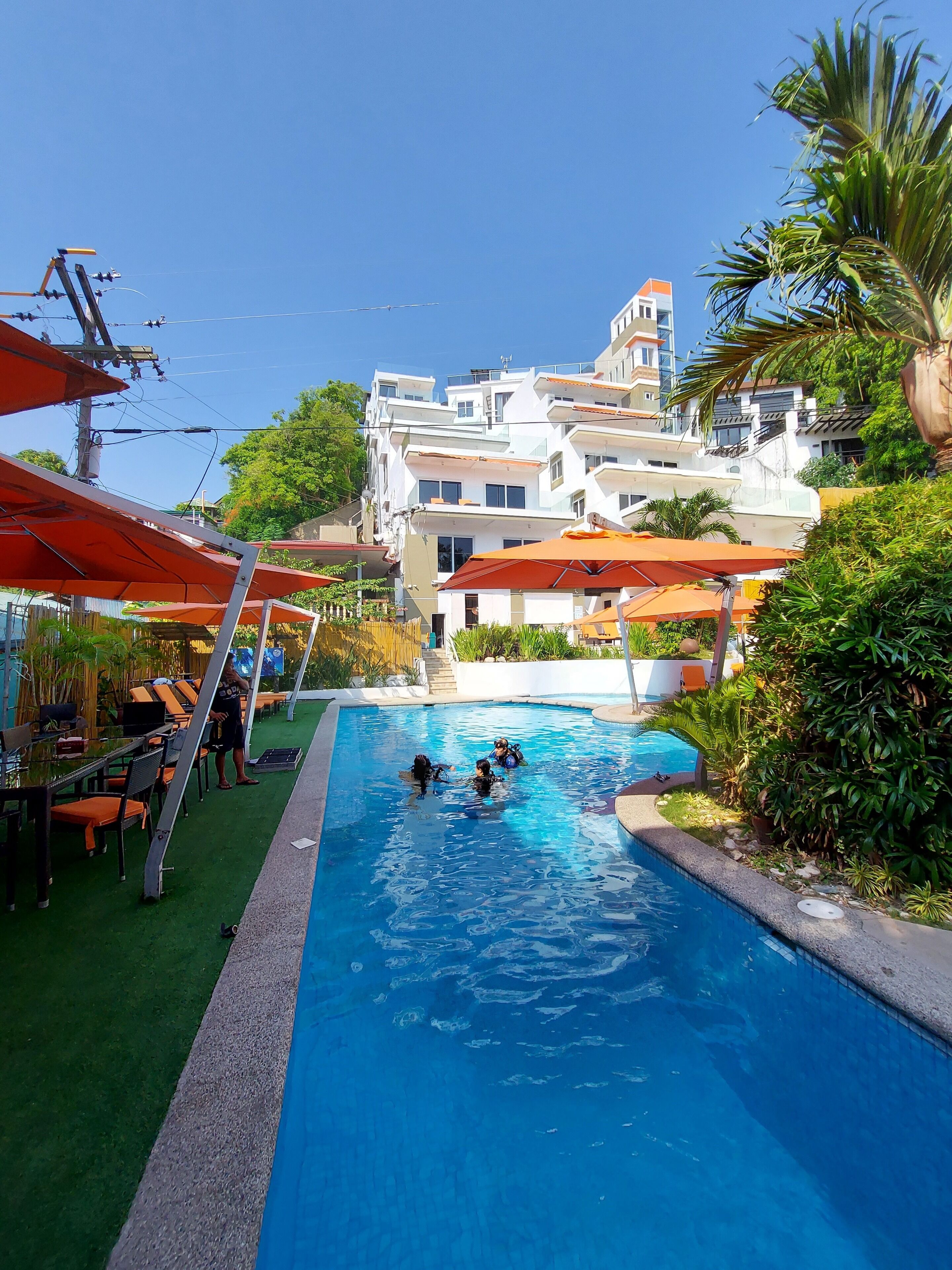 outdoor pool, pool umbrellas, pool loungers