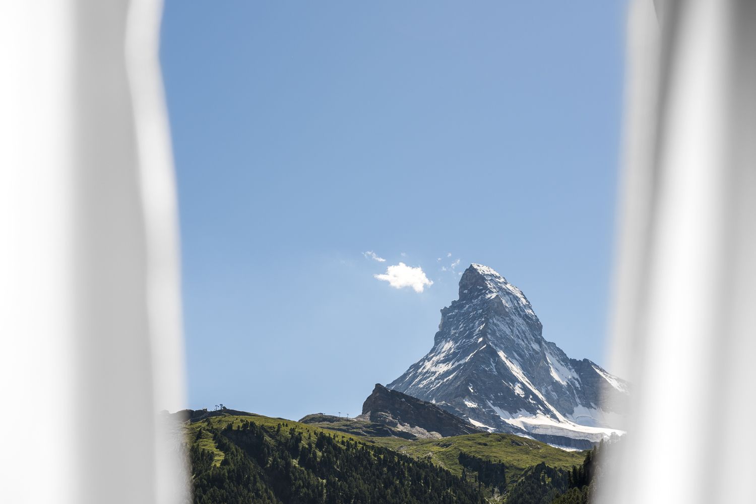 A mountain peak with a clear sky.