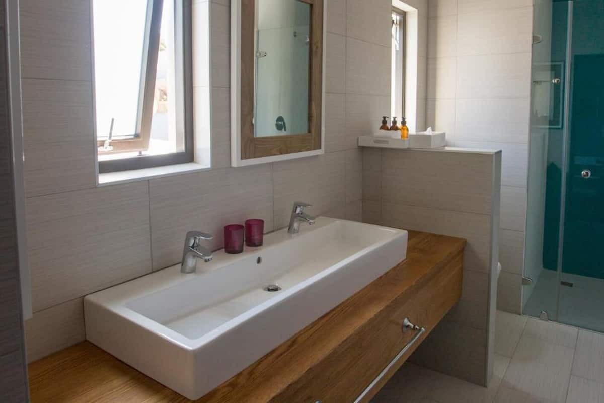 shower, rainfall showerhead, hair dryer, towels