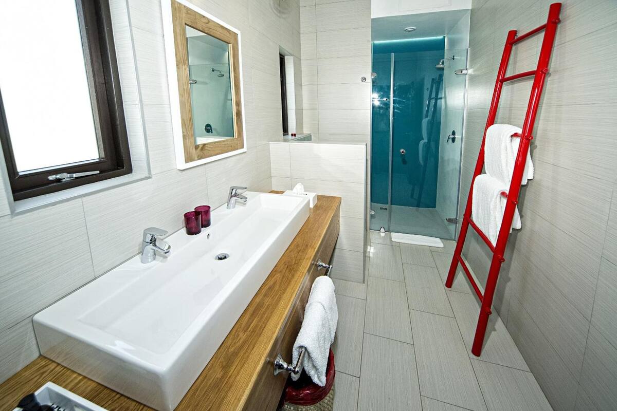 shower, rainfall showerhead, hair dryer, towels