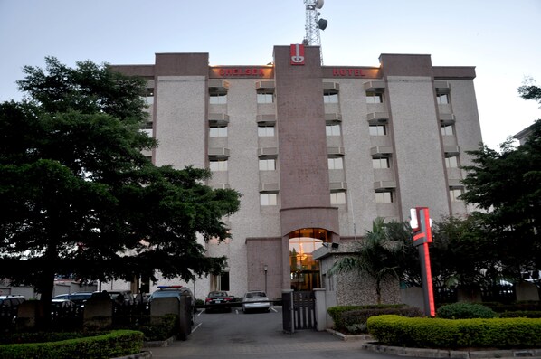 A hotel with a prominent sign reading "CHELSEA HOTEL" and a modern architectural design. - Hotel Chelsea Wuse 2 (Abuja)