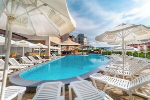 Outdoor pool, pool umbrellas, sun loungers