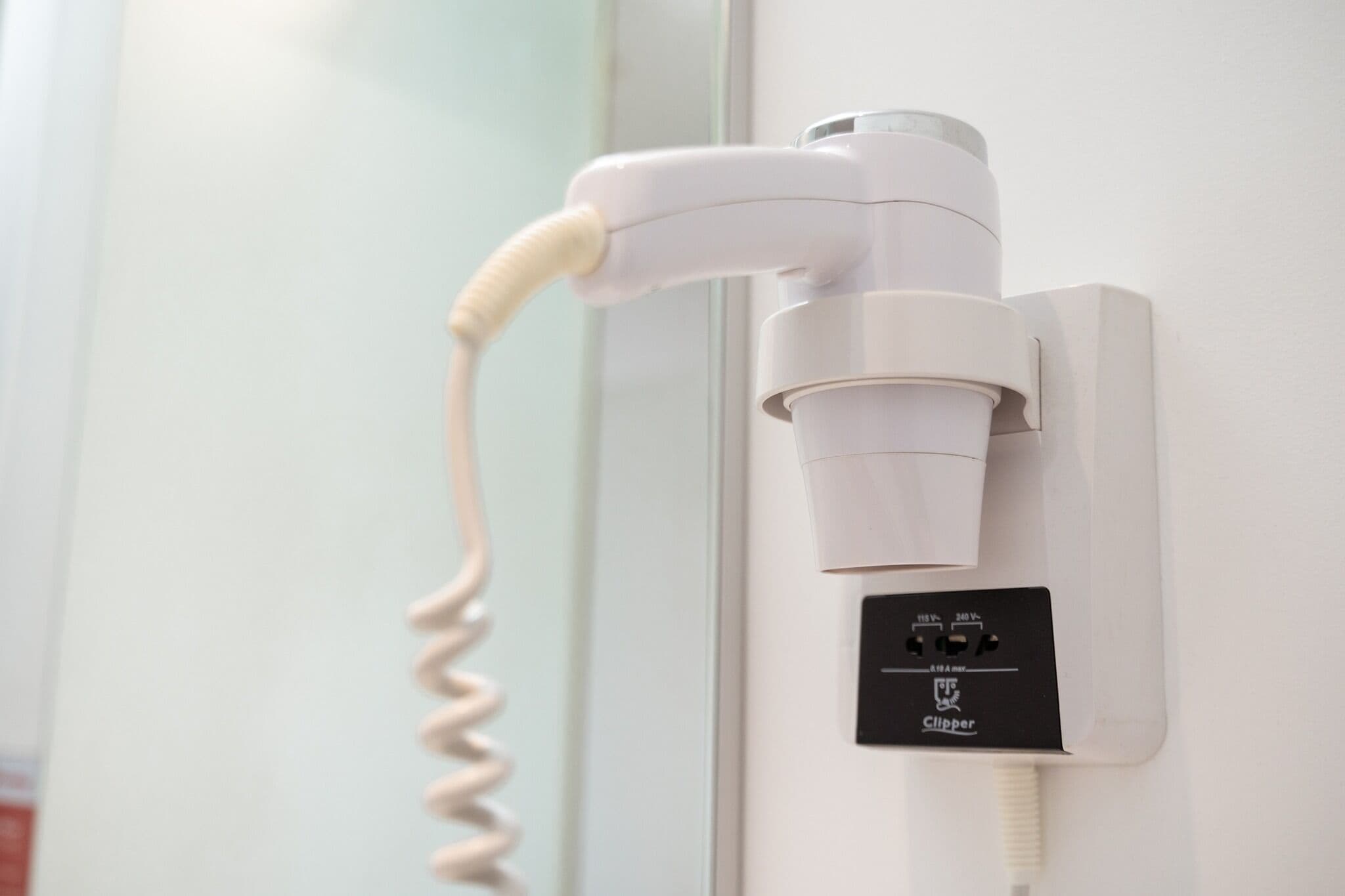 shower, hair dryer, slippers, towels