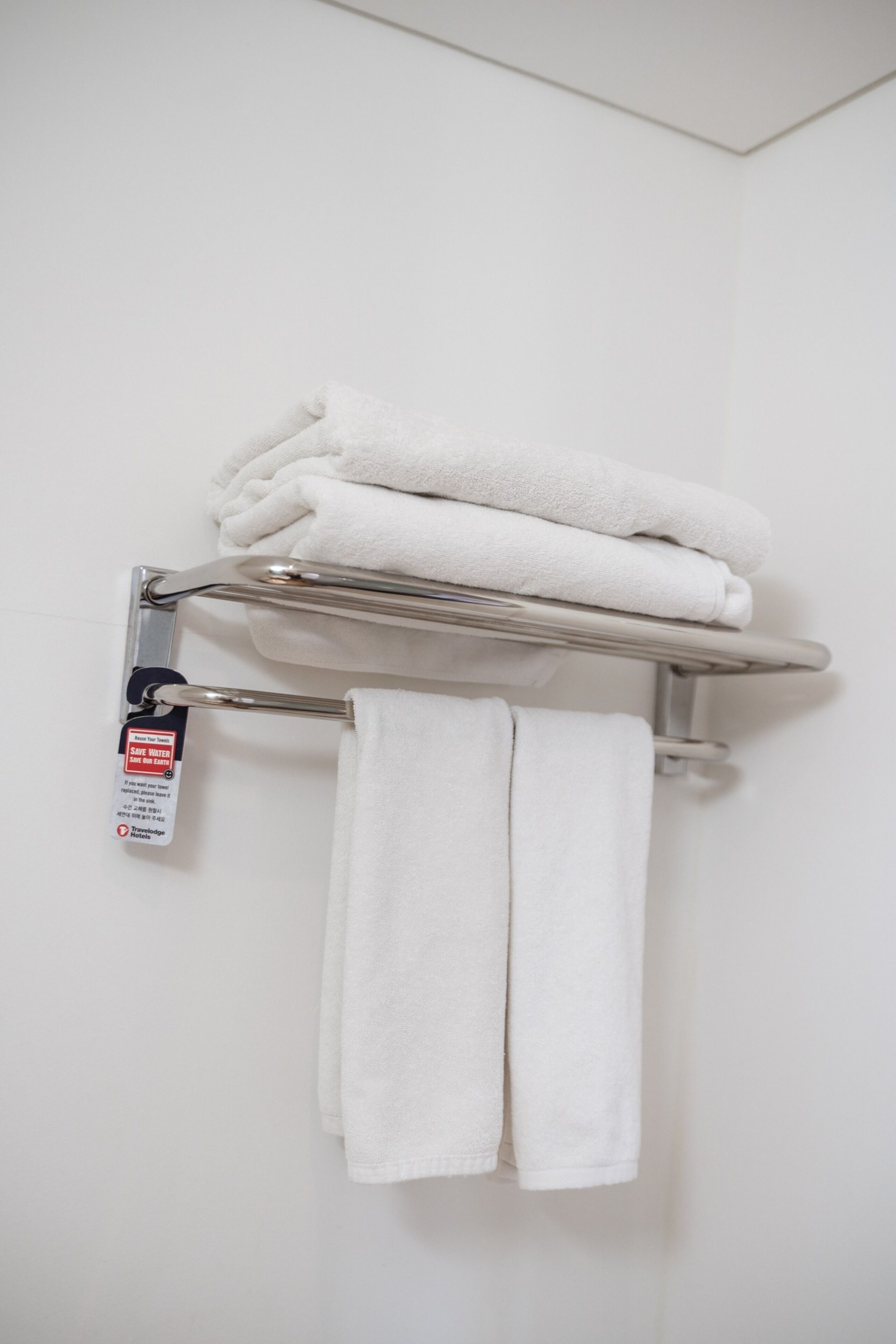 shower, hair dryer, slippers, towels