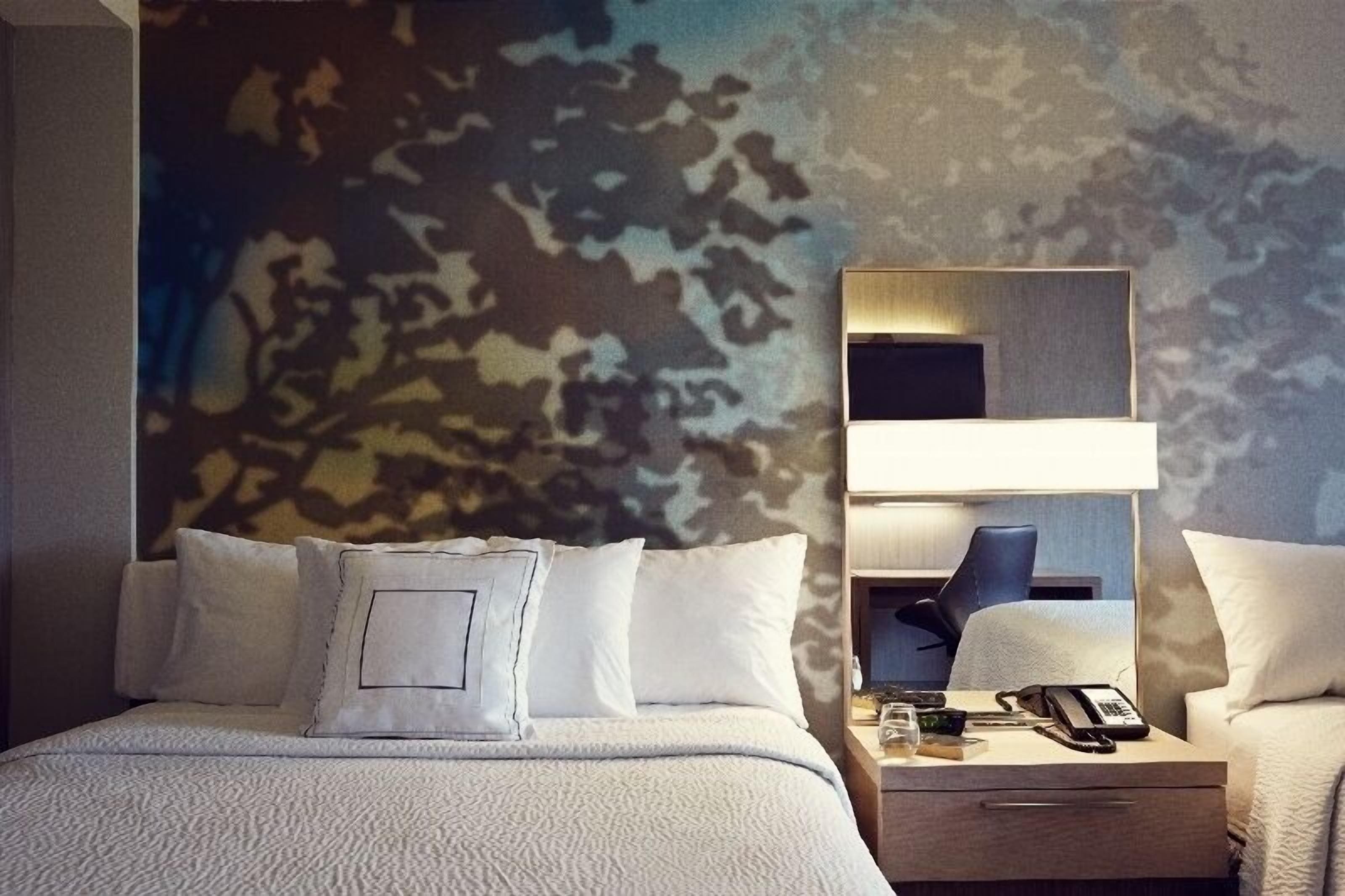 hypo-allergenic bedding, desk, laptop workspace, blackout curtains