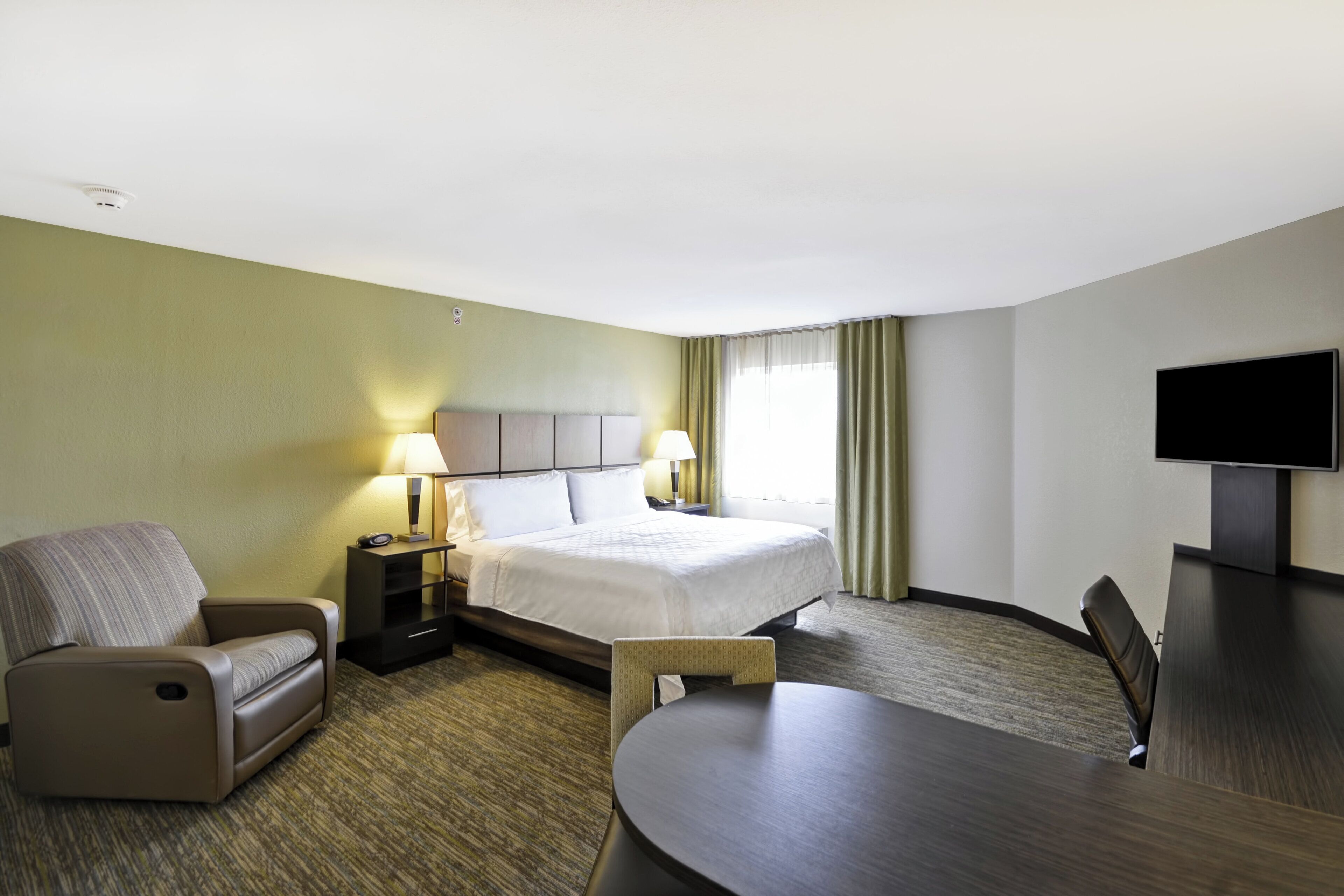 Premium bedding, pillow-top beds, desk, laptop workspace