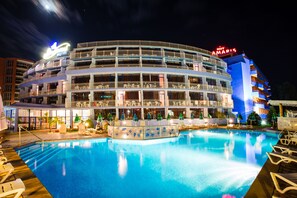 A hotel with a pool area, multiple balconies, and a sign reading "HOT AMARIS." - Bohemi (Nessebar)