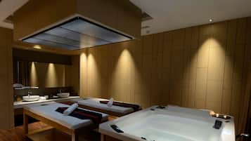Relax in a serene spa room with two separate treatment areas and large hot tubs.