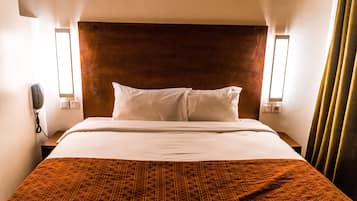 Ropa de cama de alta calidad, minibar, caja fuerte y escritorio