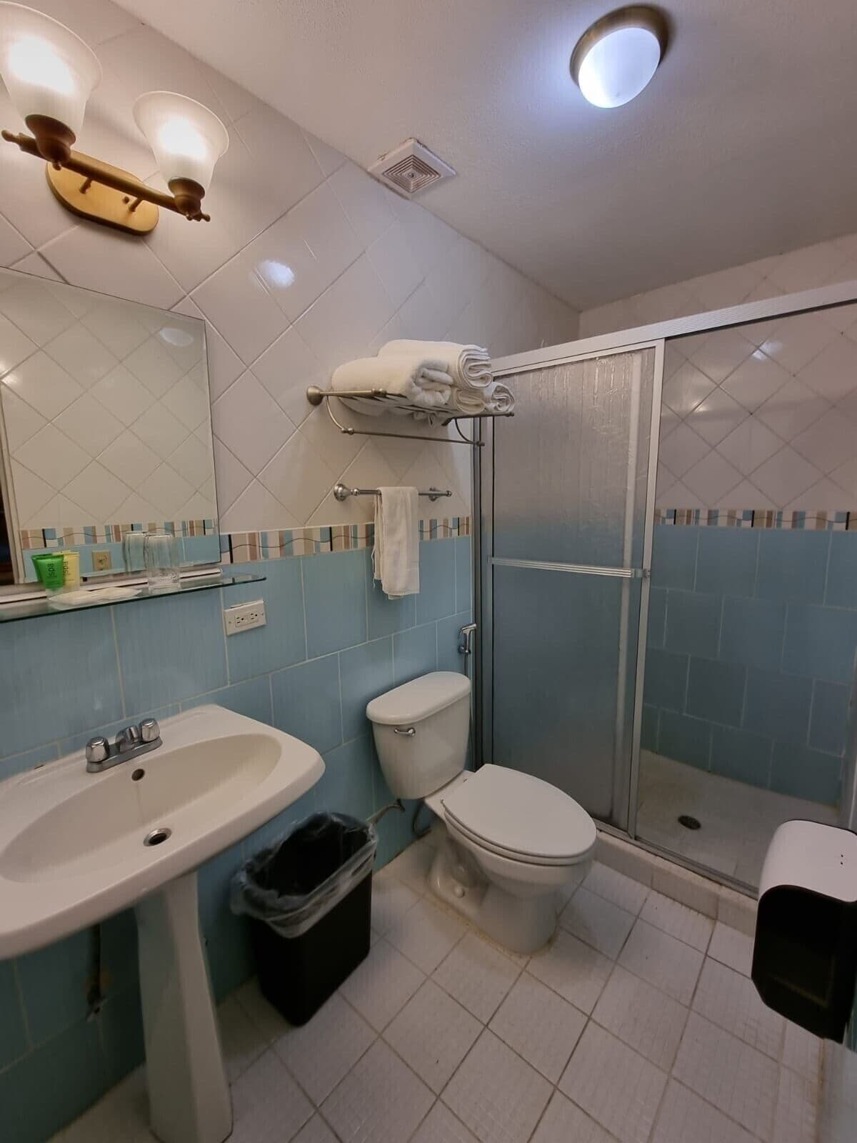 double room, 2 double beds | bathroom | shower, free toiletries, towels