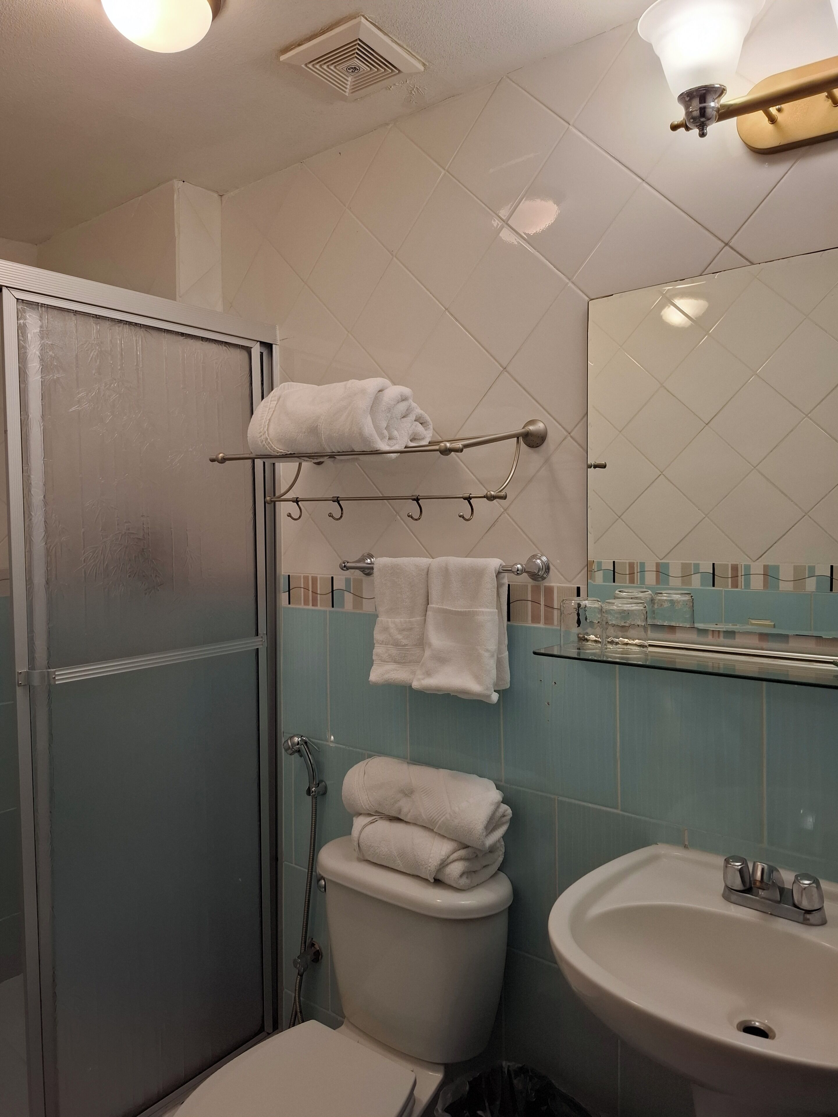 family triple room, multiple beds | bathroom | shower, free toiletries, towels