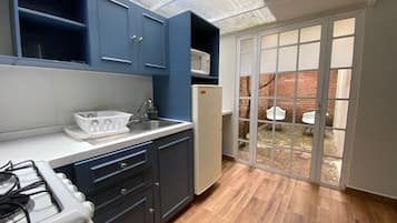 Signature Apartment, Terrace | Living area | 32-inch TV with cable channels