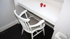 A white chair with a cushioned seat and backrest, positioned under a white counter with a small step. - 19 Oda Bozcaada (Adults Only) (Bozcaada)